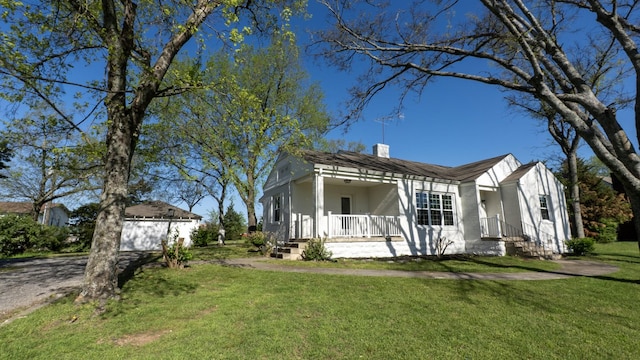 259 W End Hts, Lebanon, TN 37087 - view of front of property featuring a front lawn, a garage, a porch, a chimney, and driveway