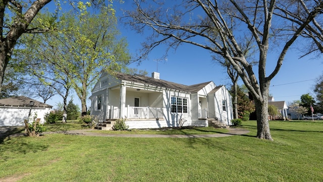 259 W End Hts, Lebanon, TN 37087 - view of front of home with covered porch, a chimney, and a front lawn