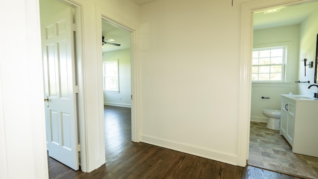 259 W End Hts, Lebanon, TN 37087 - corridor with dark wood-style flooring, baseboards, and a healthy amount of sunlight