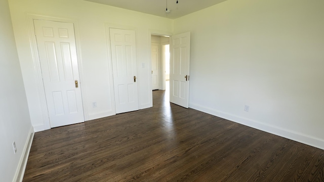 259 W End Hts, Lebanon, TN 37087 - unfurnished bedroom with baseboards and dark wood finished floors