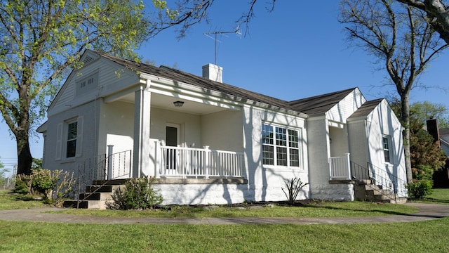 259 W End Hts, Lebanon, TN 37087 - exterior space featuring a front lawn, covered porch, and a chimney
