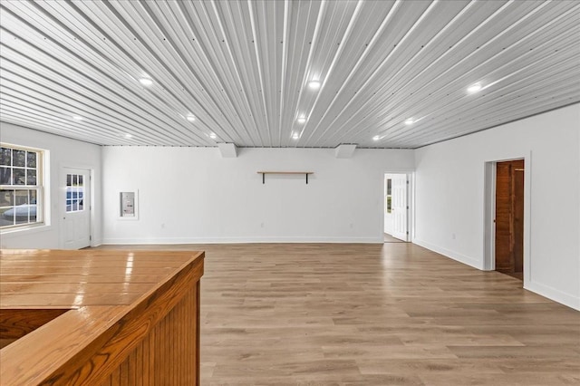 interior space with recessed lighting, baseboards, and light wood-type flooring