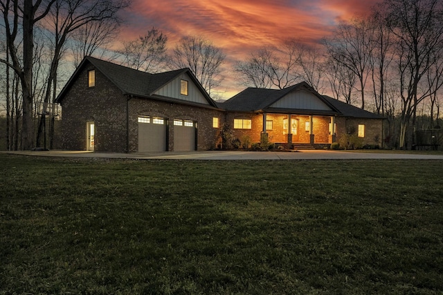 1017 Cliff View Dr N, Kingston Springs, TN 37082 - view of front of property with board and batten siding, a lawn, a garage, and driveway