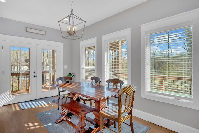 1017 Cliff View Dr N, Kingston Springs, TN 37082 - dining room featuring french doors, baseboards, a notable chandelier, and wood finished floors