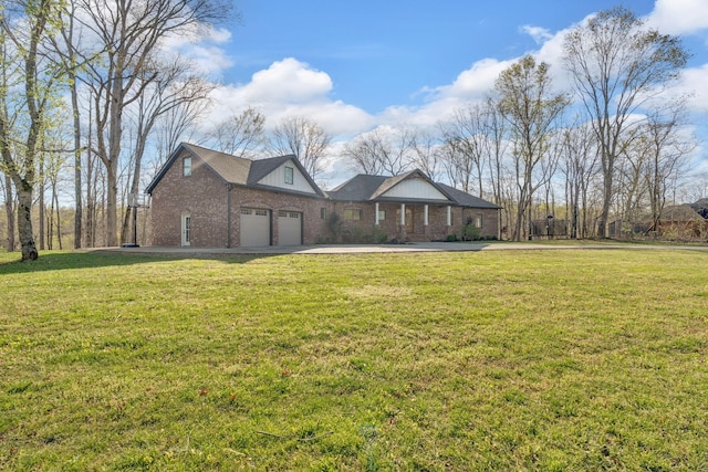 1017 Cliff View Dr N, Kingston Springs, TN 37082 - exterior space with a front yard, brick siding, driveway, and an attached garage
