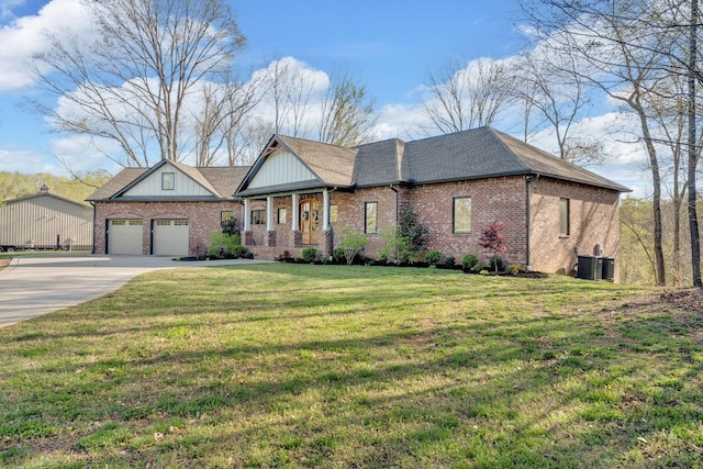 1017 Cliff View Dr N, Kingston Springs, TN 37082 - view of front of property featuring concrete driveway, central air condition unit, an attached garage, a front lawn, and brick siding