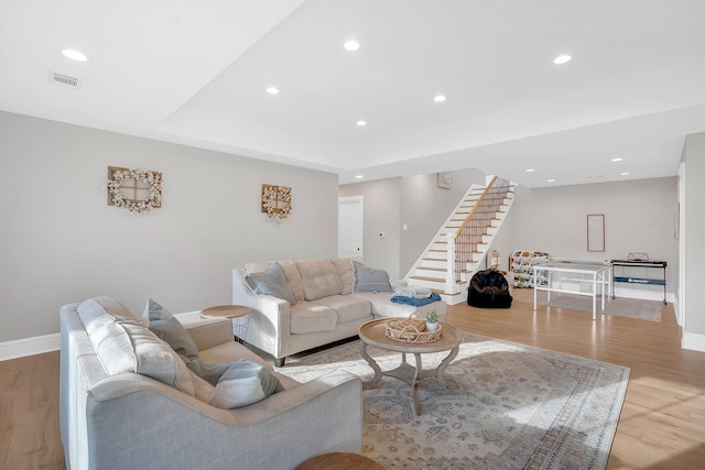 1017 Cliff View Dr N, Kingston Springs, TN 37082 - living room with baseboards, recessed lighting, stairway, visible vents, and light wood finished floors