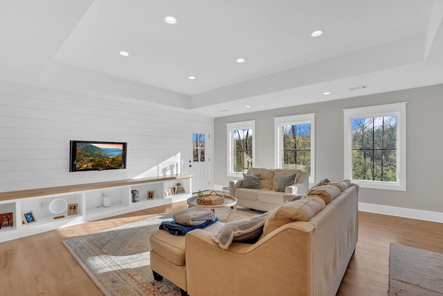 1017 Cliff View Dr N, Kingston Springs, TN 37082 - living room with visible vents, baseboards, wood finished floors, and a raised ceiling
