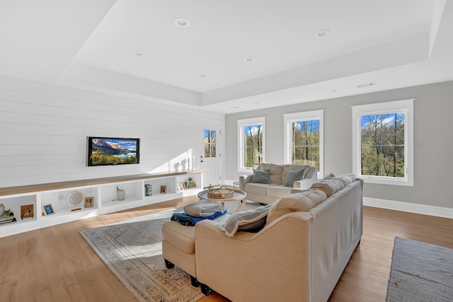 1017 Cliff View Dr N, Kingston Springs, TN 37082 - living area featuring a tray ceiling, visible vents, recessed lighting, wood finished floors, and baseboards