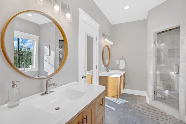 1017 Cliff View Dr N, Kingston Springs, TN 37082 - bathroom featuring two vanities, baseboards, a shower stall, marble finish floor, and a sink
