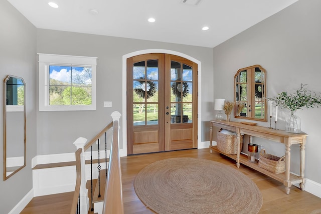 1017 Cliff View Dr N, Kingston Springs, TN 37082 - foyer entrance featuring baseboards, recessed lighting, french doors, arched walkways, and wood finished floors