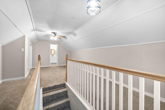 additional living space with lofted ceiling, baseboards, carpet, and ceiling fan