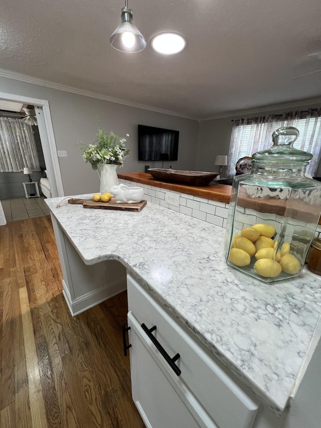 22 Jean Dr, Carthage, TN 37030 - kitchen with dark wood-type flooring, ornamental molding, baseboards, and hanging light fixtures
