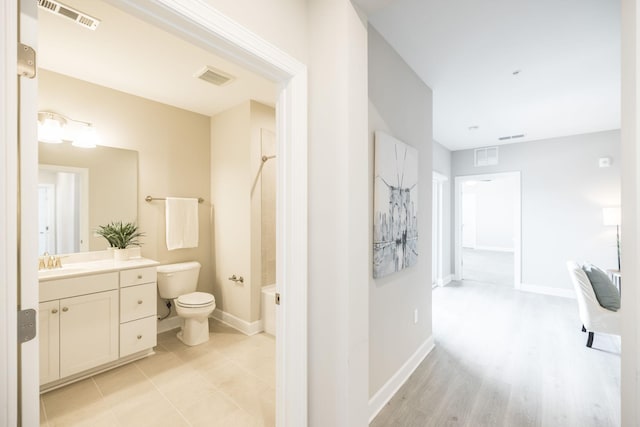 full bathroom featuring baseboards, visible vents, and toilet