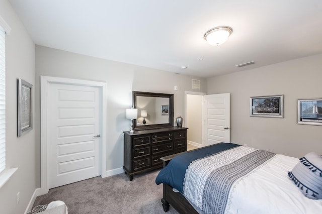 bedroom featuring carpet flooring, baseboards, and visible vents
