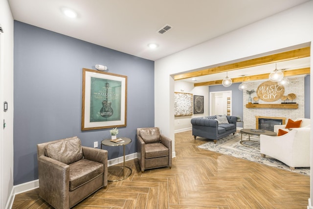 living area with baseboards, a fireplace, visible vents, and recessed lighting