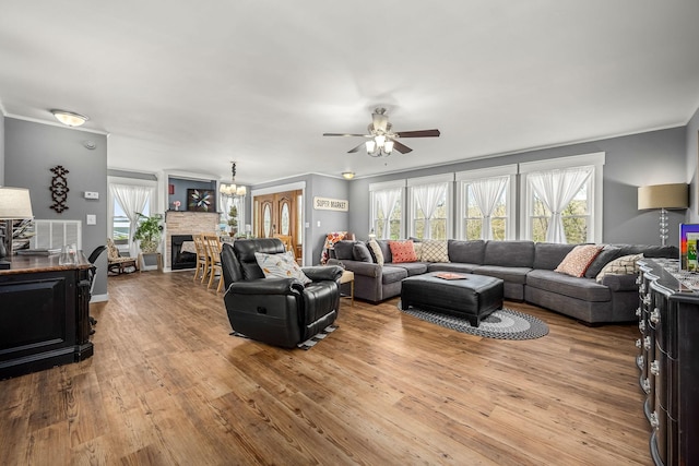 1036 Locke Creek Rd, Readyville, TN 37149 - living area with a fireplace, crown molding, wood finished floors, and a ceiling fan