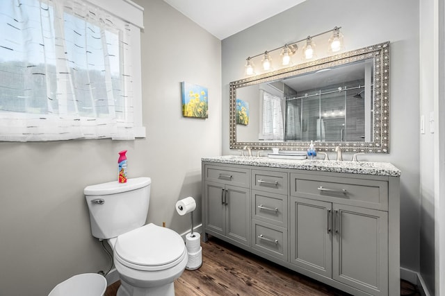 1036 Locke Creek Rd, Readyville, TN 37149 - bathroom with a shower stall, double vanity, toilet, wood finished floors, and a sink