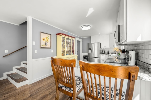 1036 Locke Creek Rd, Readyville, TN 37149 - kitchen featuring decorative backsplash, white cabinets, ornamental molding, wood finished floors, and stainless steel appliances