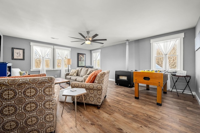 1036 Locke Creek Rd, Readyville, TN 37149 - living room featuring baseboards, visible vents, wood finished floors, and a ceiling fan