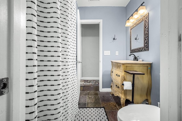 1036 Locke Creek Rd, Readyville, TN 37149 - bathroom featuring vanity, stone tile floors, baseboards, visible vents, and curtained shower