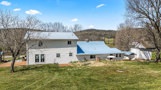1036 Locke Creek Rd, Readyville, TN 37149 - back of property with a lawn and metal roof