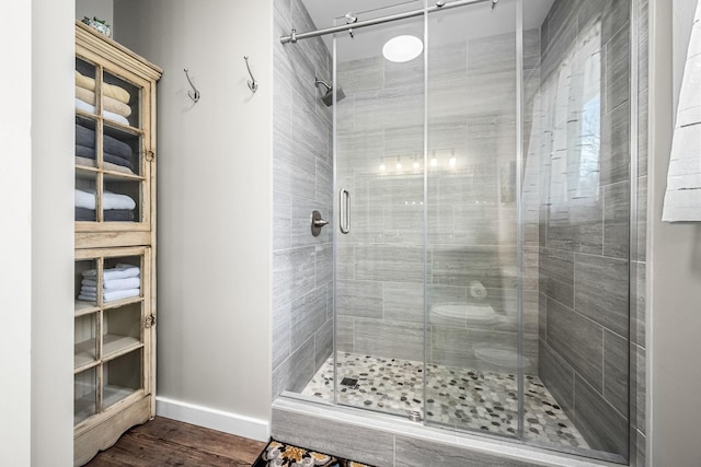 1036 Locke Creek Rd, Readyville, TN 37149 - full bathroom with baseboards, wood finished floors, and a shower stall