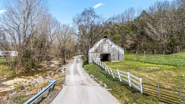 1036 Locke Creek Rd, Readyville, TN 37149 - view of road with a forest view and a barn
