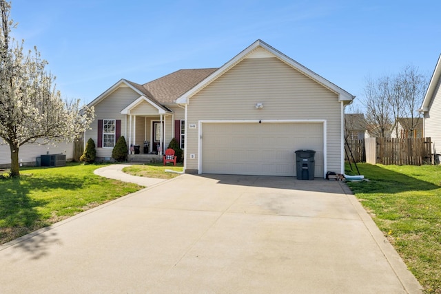 3648 S Jot Dr, Clarksville, TN 37040 - ranch-style house featuring driveway, central AC unit, fence, and a front lawn