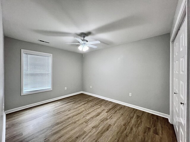 402 Pine St, Pulaski, TN 38478 - unfurnished bedroom featuring a closet, dark wood finished floors, baseboards, and ceiling fan