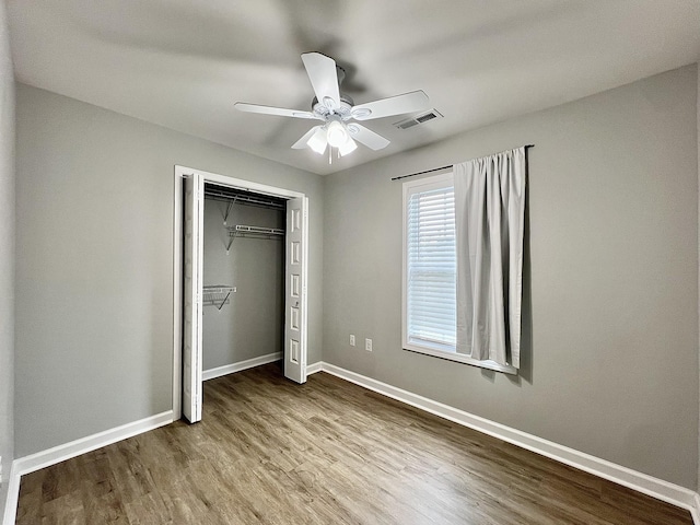 402 Pine St, Pulaski, TN 38478 - unfurnished bedroom featuring wood finished floors, baseboards, a closet, and a ceiling fan
