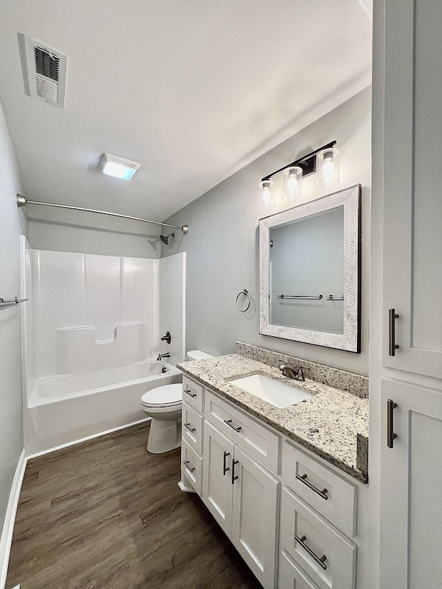 402 Pine St, Pulaski, TN 38478 - bathroom featuring vanity, toilet, bathtub / shower combination, and wood finished floors