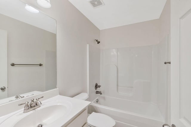 bathroom with toilet, vanity, bathtub / shower combination, and visible vents