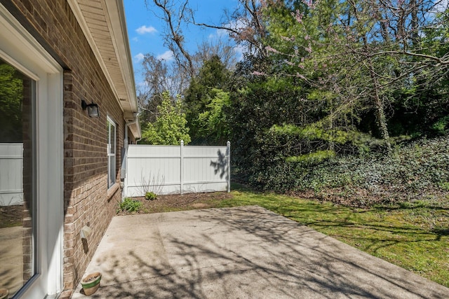 view of patio featuring fence