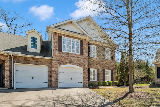 view of front of house featuring driveway and an attached garage