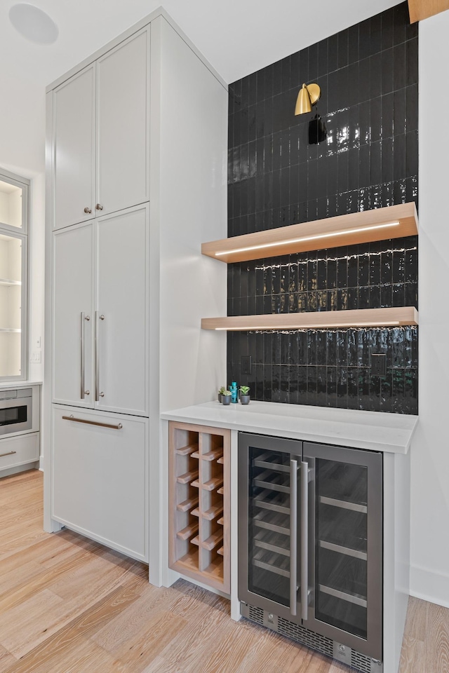 6362B Columbia Ave, Nashville, TN 37209 - bar with light wood-type flooring, a dry bar, and beverage cooler