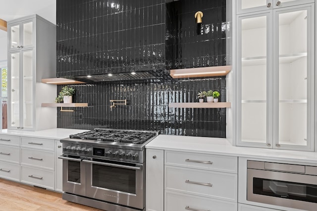 6362B Columbia Ave, Nashville, TN 37209 - kitchen with white cabinetry, double oven range, open shelves, and tasteful backsplash