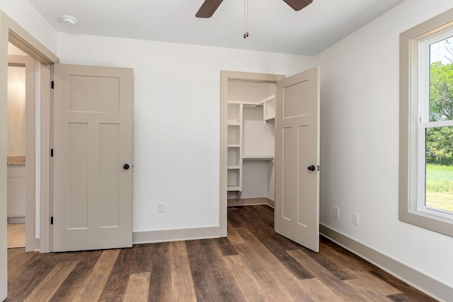 12 Lonsvale Dr, Mcminnville, TN 37110 - unfurnished bedroom featuring baseboards, ceiling fan, wood finished floors, and a spacious closet