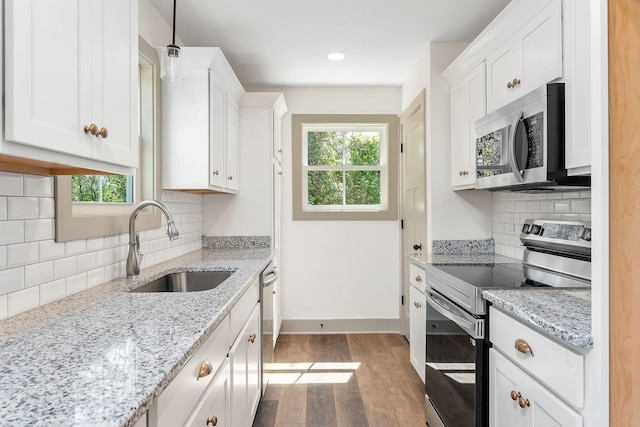 12 Lonsvale Dr, Mcminnville, TN 37110 - kitchen with dark wood-style flooring, appliances with stainless steel finishes, a wealth of natural light, and a sink
