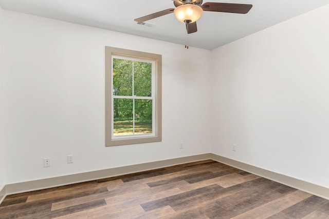 12 Lonsvale Dr, Mcminnville, TN 37110 - empty room with visible vents, a ceiling fan, baseboards, and dark wood-style floors