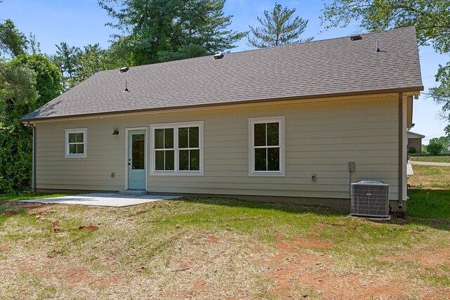 12 Lonsvale Dr, Mcminnville, TN 37110 - back of house featuring a yard, cooling unit, a shingled roof, and a patio area