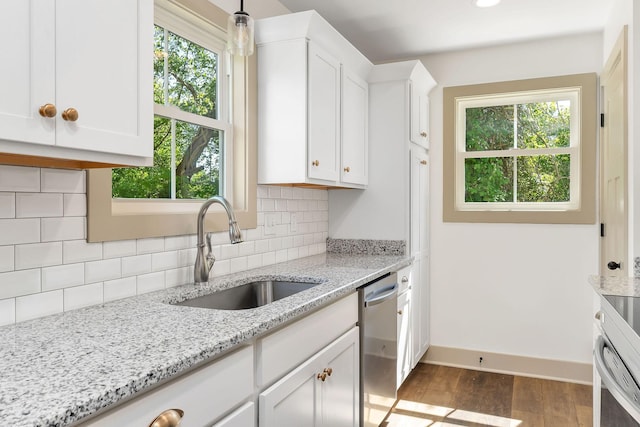12 Lonsvale Dr, Mcminnville, TN 37110 - kitchen with stainless steel dishwasher, decorative backsplash, dark wood-style floors, white cabinets, and a sink