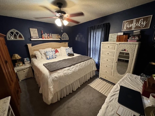 bedroom featuring a ceiling fan, carpet floors, and a textured ceiling