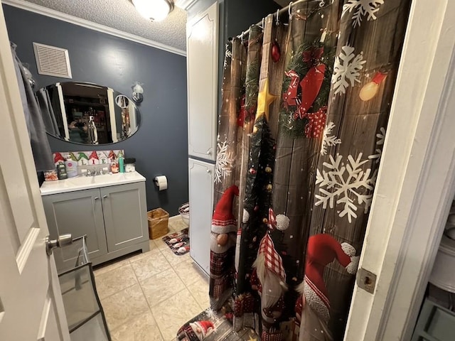 full bath featuring tile patterned floors, curtained shower, vanity, a textured ceiling, and visible vents