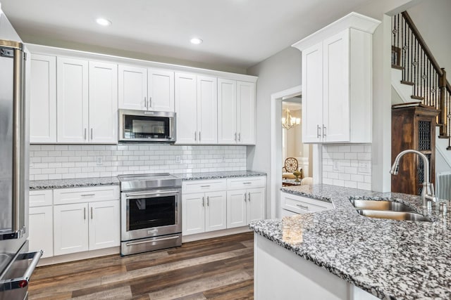 120 Sideview Rd, Gallatin, TN 37066 - kitchen featuring white cabinetry, dark wood-style flooring, a sink, and stainless steel appliances