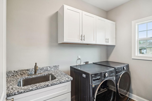 120 Sideview Rd, Gallatin, TN 37066 - laundry area featuring baseboards, cabinet space, a sink, and washer and clothes dryer