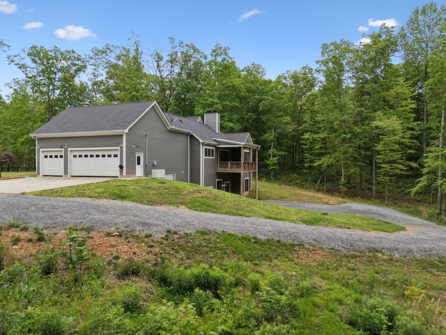 6033 Vesper Way E, Franklin, TN 37064 - view of side of home featuring concrete driveway, a chimney, and a garage