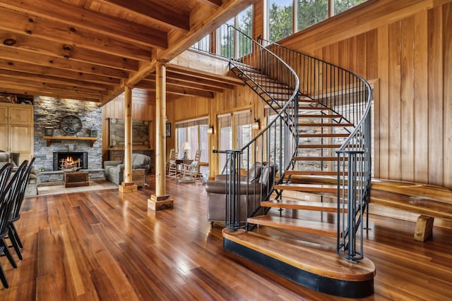 staircase with wood walls and plenty of natural light