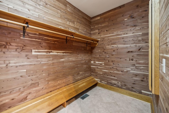 walk in closet with tile patterned floors