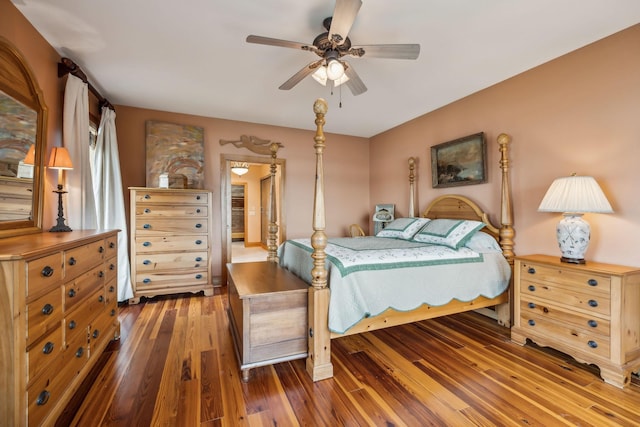 bedroom with a ceiling fan and hardwood / wood-style flooring